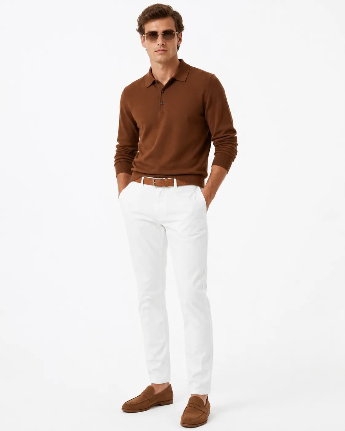 The Cocoa Weekender look on a model: cocoa long-sleeved polo, white chinos, cognac belt and amber-tinted sunglasses, on white